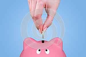 Hand and piggy bank