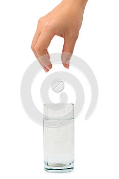 Hand, pill and water glass