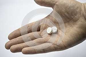 Hand pill white medication giving healtcare concept room for text