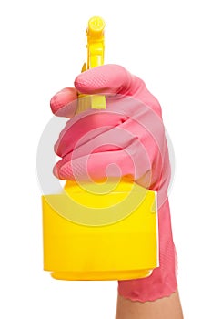 Hand in a pink glove holding spray bottle