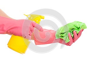 Hand in a pink glove holding spray and sponge