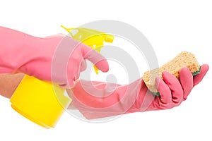 Hand in a pink glove holding spray and sponge