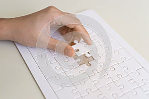 hand and jigsaw puzzle