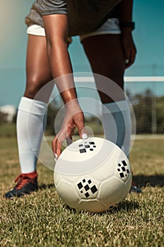 Hand, placing and soccer ball on field for free kick, penalty or goal in game, training or match. Woman, football and