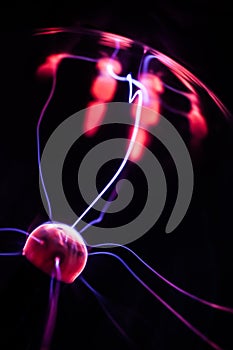 Hand and plasma ball flames on a black background photo