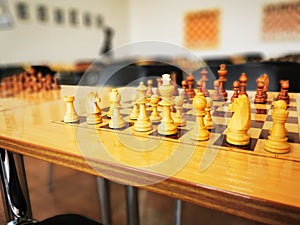 Hand of the player moving chess pieces in the chess tournament. Strategy, Management or Leadership Concept