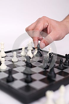 Hand is playing chess