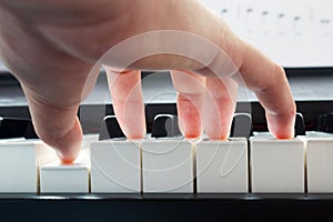 Hand playing piano