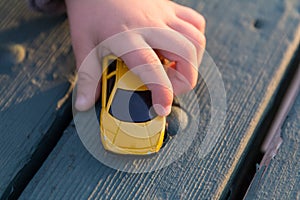 Hand Playing with Toy Car