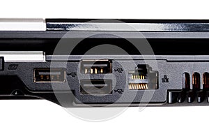 Hand plugging an usb plug into the socket of a laptop