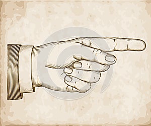 Hand with pointing finger. Woodcut photo