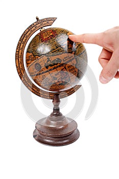 Hand pointing at globe