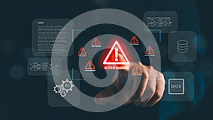 Hand pointing at glowing system warning alert with data and AI icons in digital interface, symbolizing cybersecurity risk