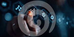 A hand is pointing at a graph on a computer screen