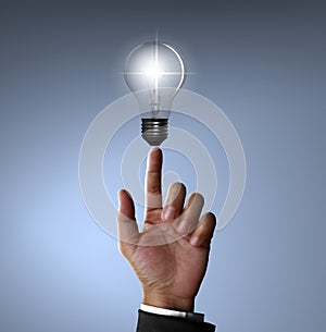 Hand pointing Light bulb