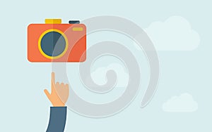 Hand pointing to a camera icon