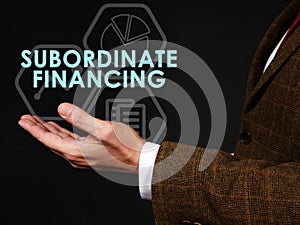 Hand points to the sign Subordinate financing.