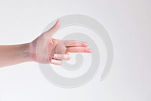 A hand pose to be gun shape on white background