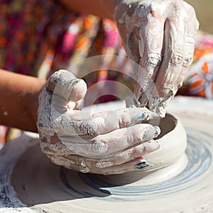 Hand on a potter wheel