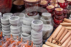 Hand pounded mortars and pestles, stone and wood type, traditional kitchen utensils sale in Thai handcraft market photo