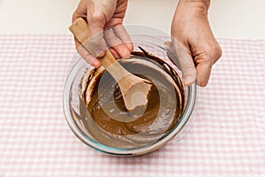 Hand preparing mixing grounded traditional medicine Chinese herb