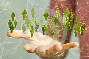 Hand presenting network with green female and male icons - world communication concept