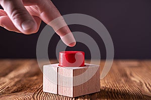 Hand press the red button