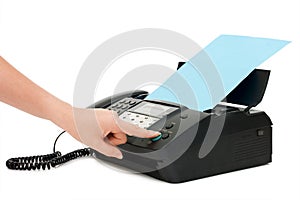 The hand presses the fax button