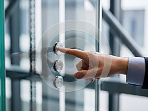 Hand pressing elevator button