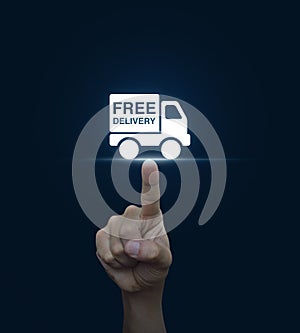 Hand pressing free delivery truck icon on blue background, Trans