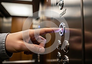 A hand is pressing the illuminated 