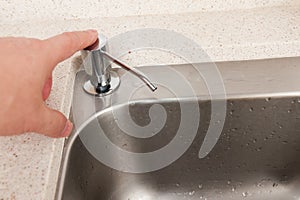 Hand pressing sanitizer