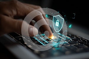 Hand pressing silver laptop key with digital security shield icon