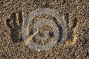 Hand print on the beach