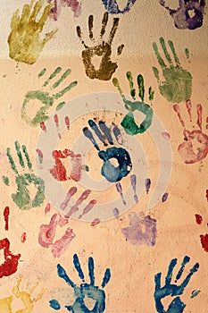 Hand prints painted on a wall
