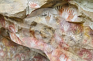 Hand prints on stone cave wall