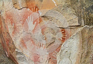 Hand prints on stone cave wall