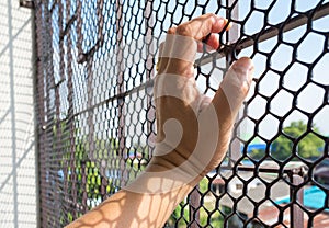 Hand of prisoner in jail