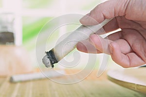 Hand with professional moxa sticks