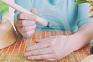 Hand with professional moxa sticks