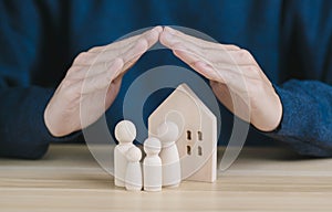 hand protect family and home. concept of life and home insurance assurance for customer and business safety, risk plan agent, and