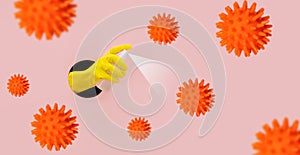 A hand in a protective glove sprinkles an antibacterial spray on the virus. Disinfection and protection against coronavirus, covid