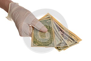 Hand in protective gloves with money isolated