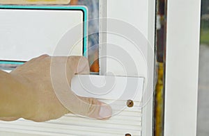 Hand pulling door to opened