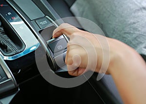 Hand pulling and pushing electric handbrake, Modern car interior