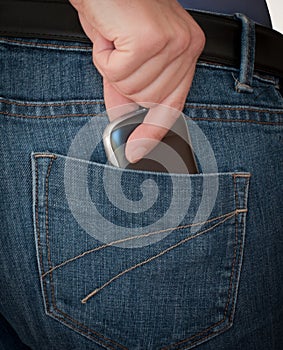 Hand pulling smartphone out of pocket