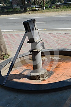 Hand pump, hand-operated water pump in a rural area of Himachal Pradesh, India. They can draw clean ground water.