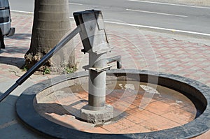 Hand pump, hand-operated water pump in a rural area of Himachal Pradesh, India. They can draw clean ground water.