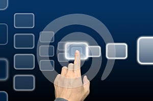 Hand pushing a button on a touch screen interface