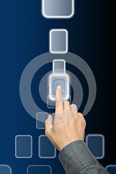 Hand pushing a button on touch screen interface